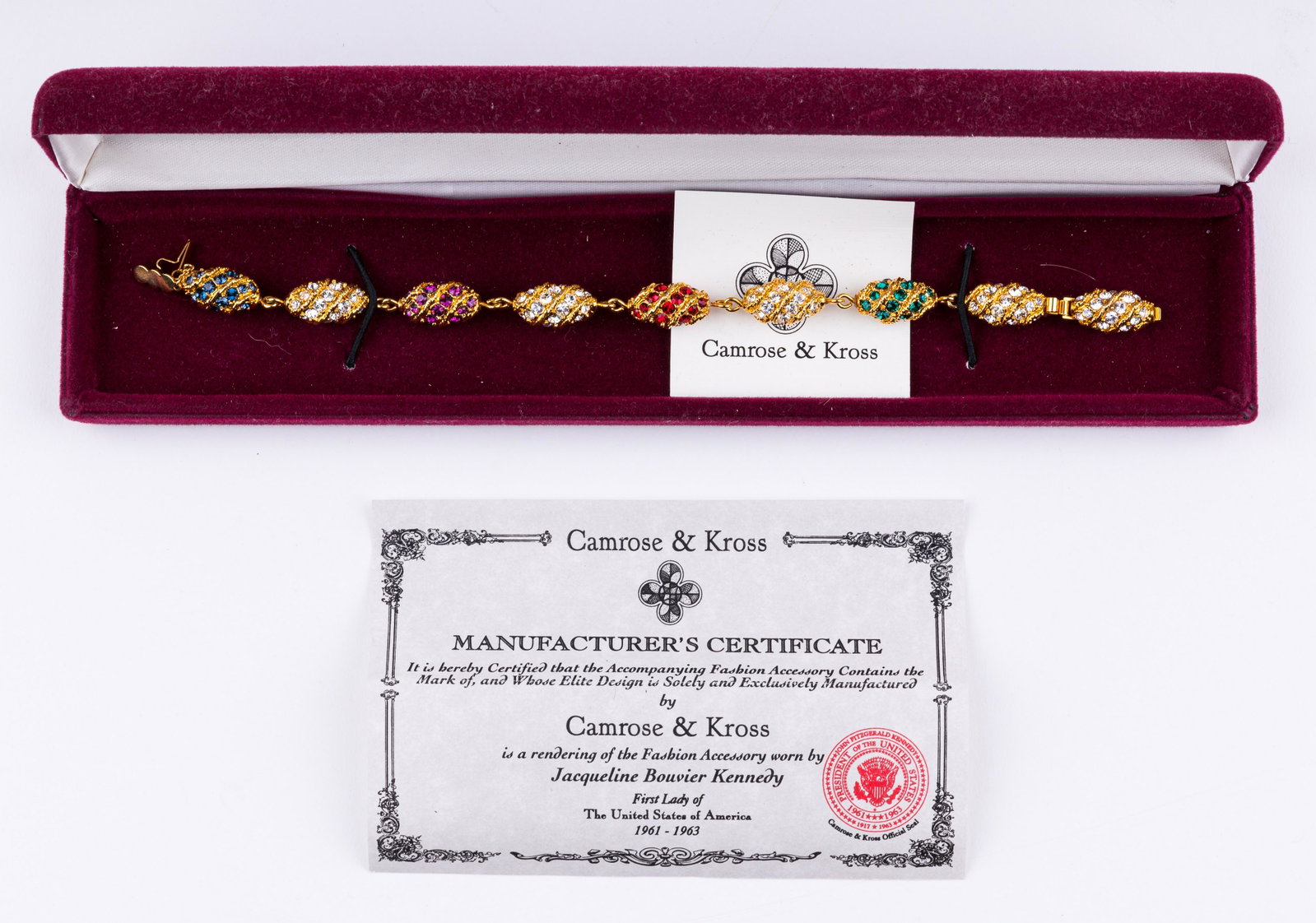 Camrose & Kross Jackie O Bracelet: Camrose and Kross bracelet approx 7.5" L and each bead is enhanced with colored glass stones. Comes with manufacturer's certificate and original box.