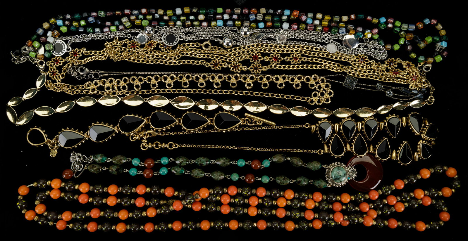 Vintage Costume Jewelry Necklaces: Lot of vintage necklaces with highlights including a Marc Jacobs silver tone necklace (approx 38" L), gold tone, green and orange necklace with central carnelian pendant.