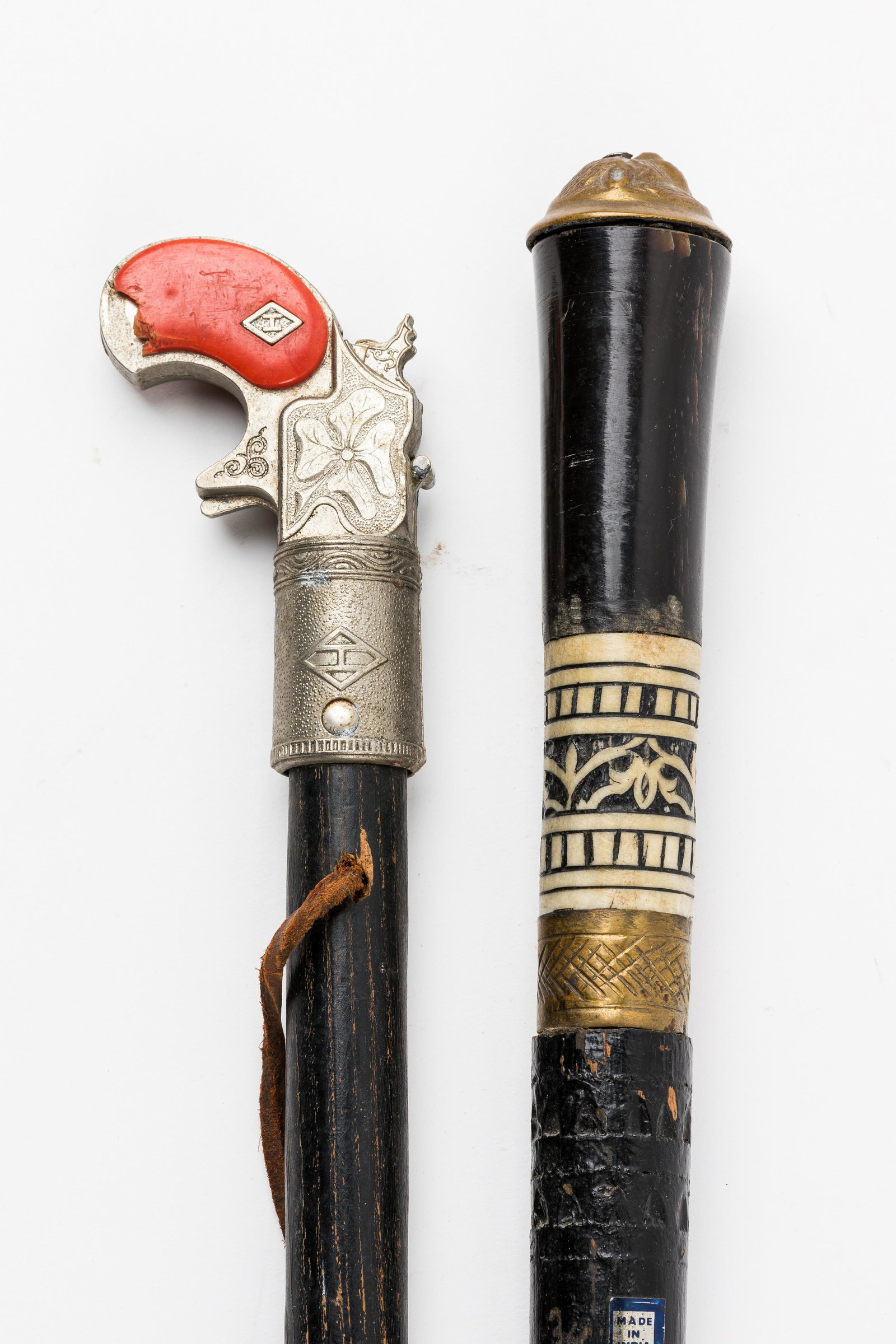 Hubley Cap Gun Case, Carved Bone and Brass Cane: Handle on cap gun has chip, longest cane is 35.5 inches.