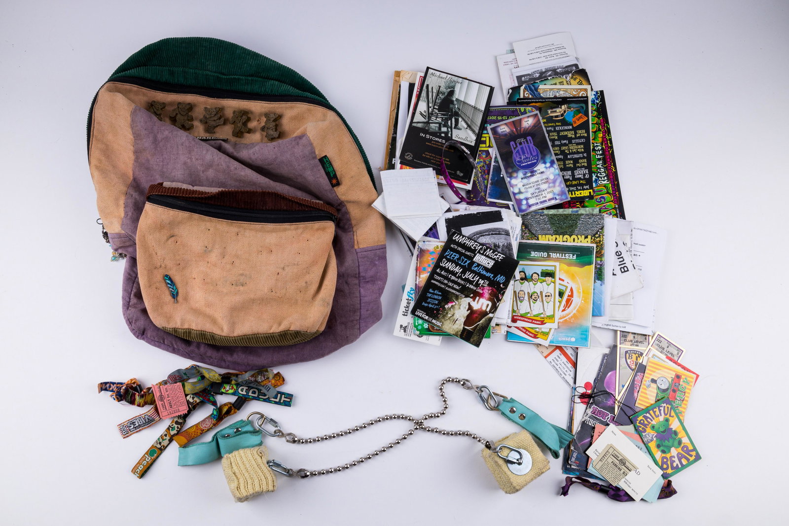 Grateful Dead and Other Concert and Event Ephemera: Dancing Bear backpack (well used), festival promption cards, festival bracelets, and other items. Approx 100 pieces in all.