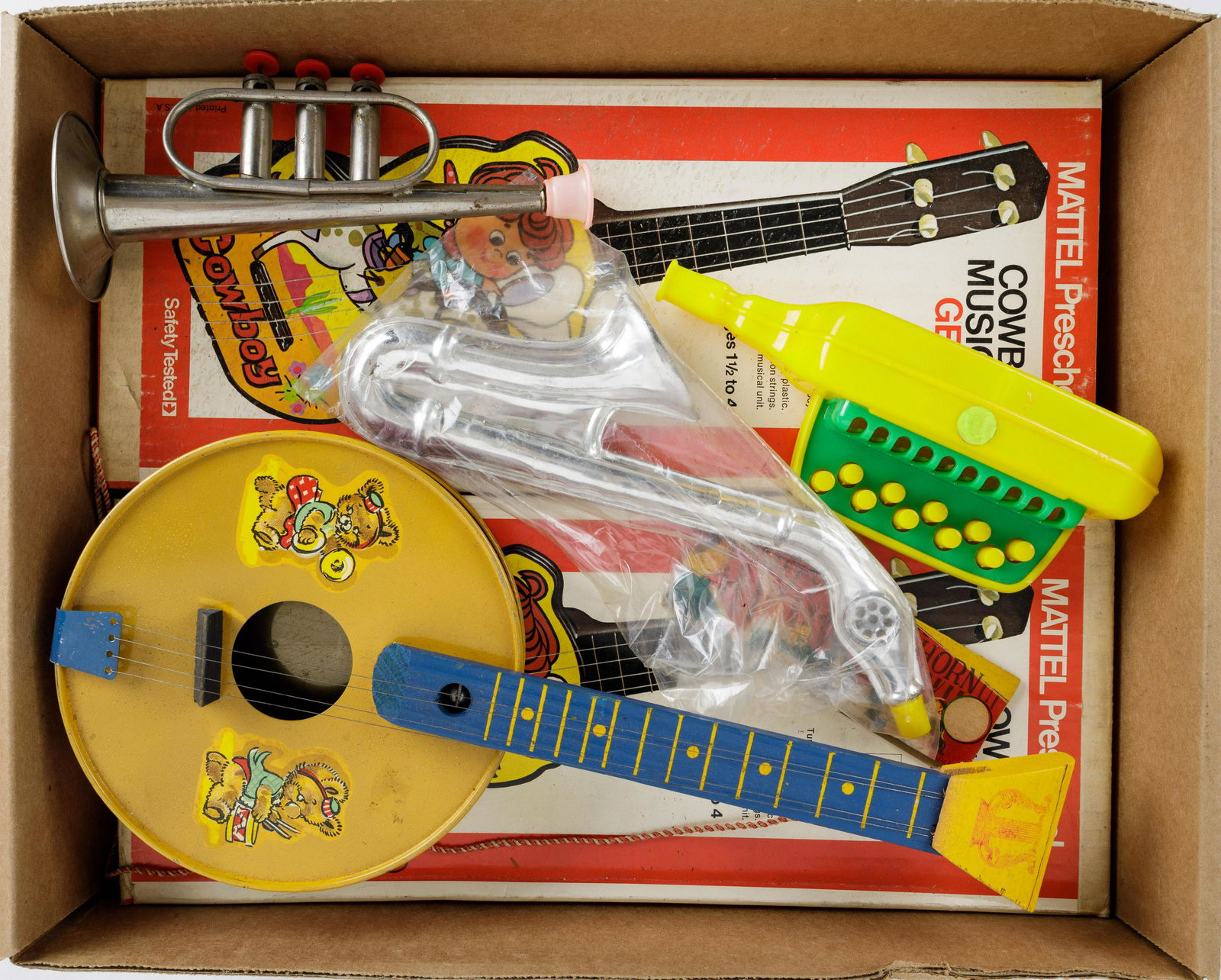 Vintage Mattel 'Ge-Tar', Noisemakers: 2 Mattel brand 'Cowboy Musical Ge-Tar' NIB, tin litho banjo, Keymonica, toy trumpet, and novelty party horn.