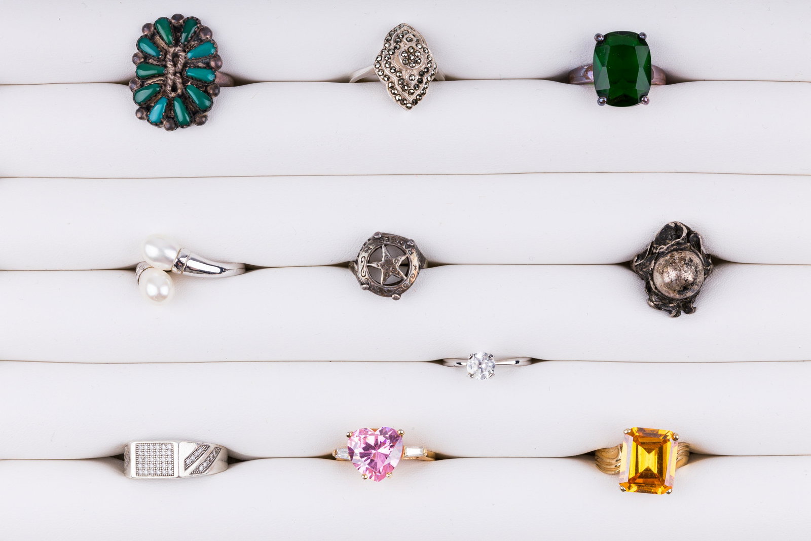 Sterling Silver Rings: Lot of 10 sterling silver rings including three that test for glass, one clear spinel, marcasite, Native American turquoise (signed RK) and more. Various sizes. See photos.