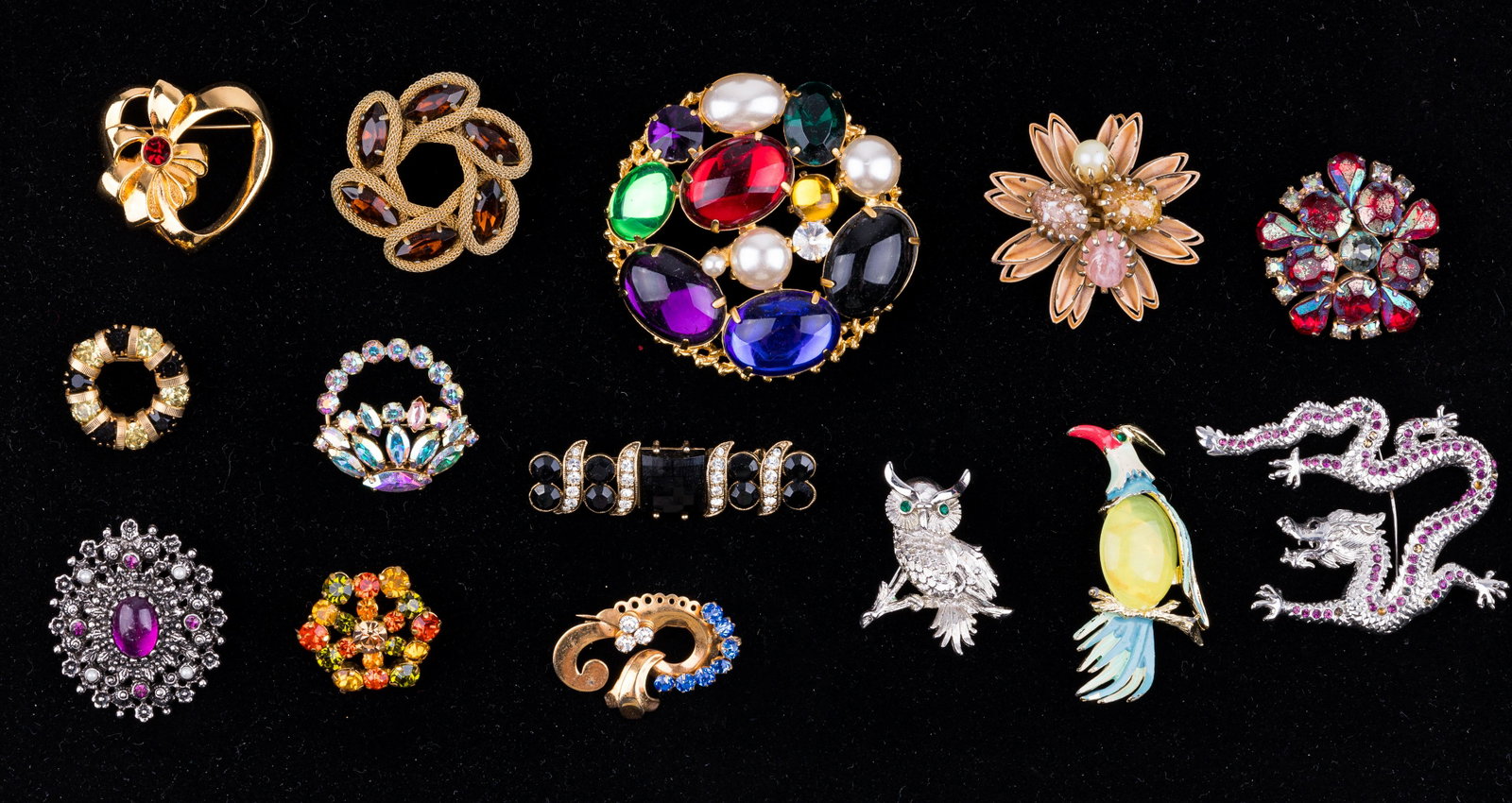 Vintage Costume Brooches: Lot of 14 brooches includes Monet (owl), Sarah Coventry and Sherman. Largest measures approx 2.75" L. Dragon is missing a couple of stones (glass). See photos.