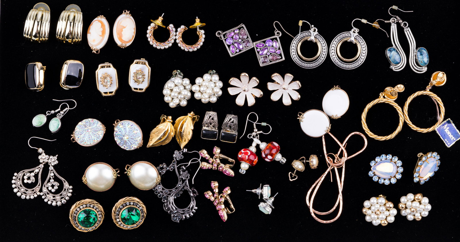 Vintage Costume Jewelry Earrings: Lot of 27 pair of earrings including names Monet, Miriam Haskell and Har. All stones test for glass. Earrings are both pierced and clip. See photos.