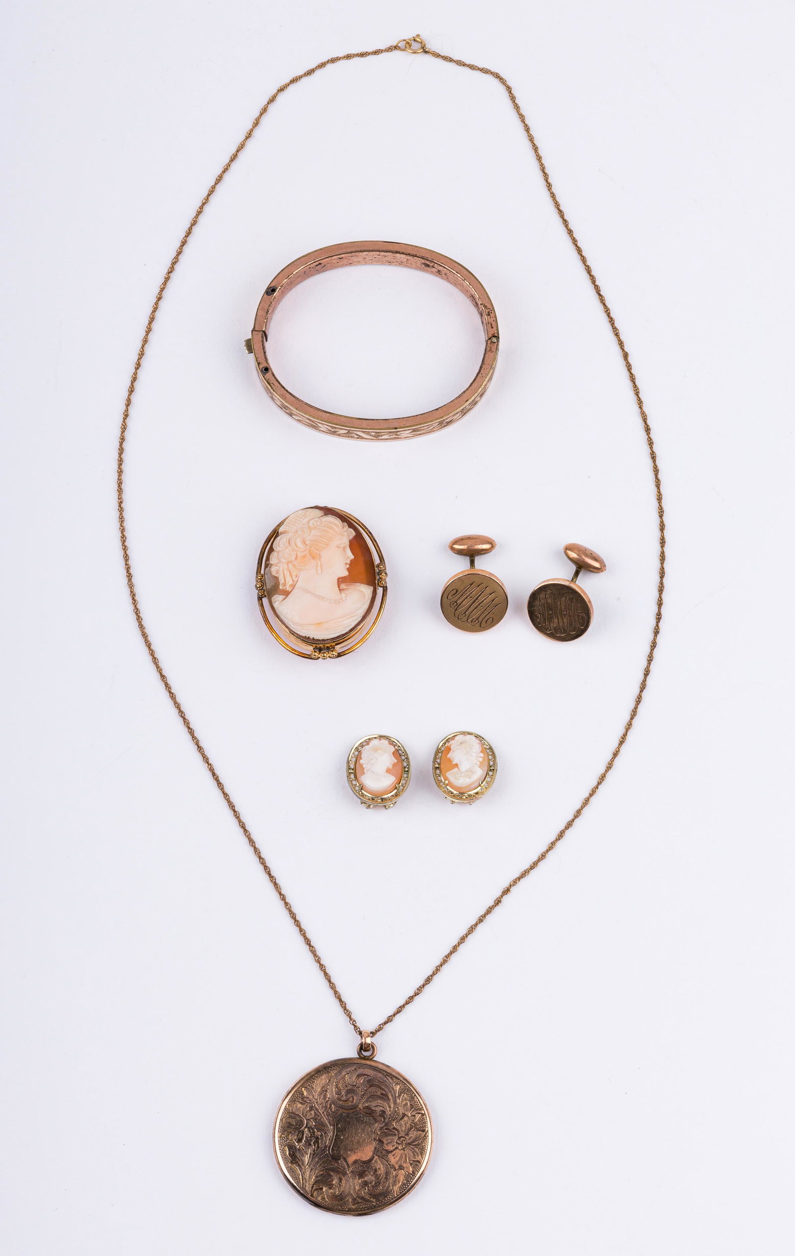Antique Gold Filled Jewelry: Lot of five includes real cameo brooch, cameo earrings (stamped 800), monogrammed cuff links, B. Manufacturing Company photo locket on chain (opens and closes well), and a copper hinged clasp bracelet