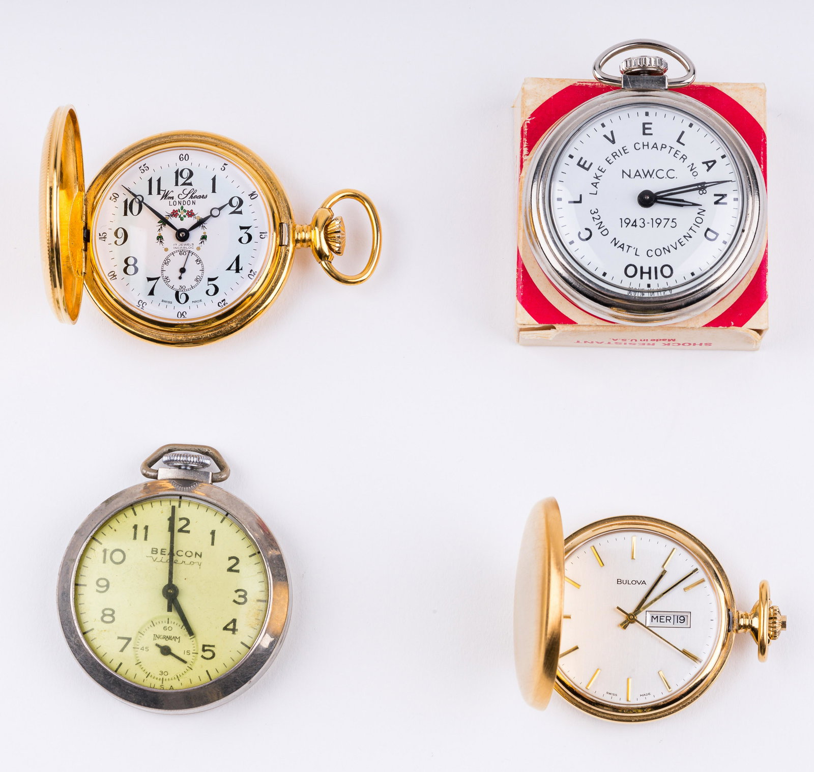 Vintage Pocket Watches: Four antique pocket watches including Ingraham Beacon Viceroy; Swiss made William Shears; 1975 NAWCC convention watch in original box; and Swiss made Bulova with engraving. All pocket watches are purp