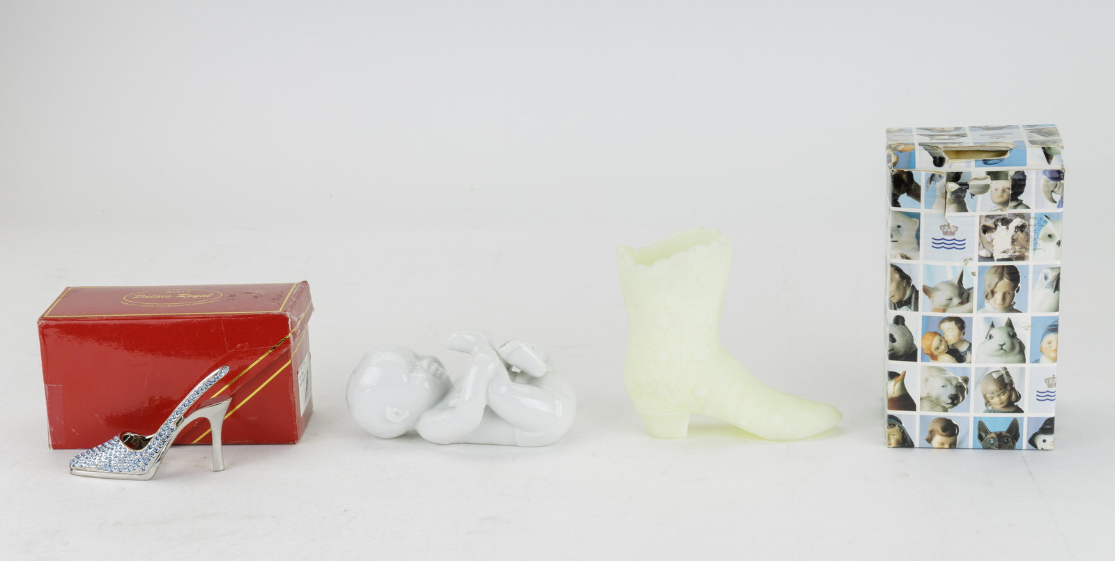 Vintage Fenton, Royal Copehangen & Juju: Lot of three vintage figurines includes Vaseline / uranium glass boot (approx 4.25" H), Royal Copenhagen lying baby (approx 5" L, with original box) and Juju Palais Royal mini heel shoe adorned with S