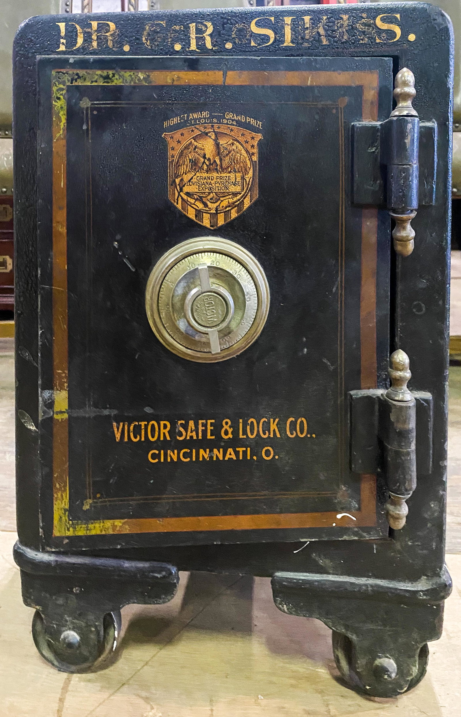 Small Victor Safe & Lock Co. Cincinnati, OH Safe: Safe has combination and key (untested), is decorated with ebonized and stenciled flowers, advertising name reads, â€œDr. C. R. Sikes”. It measures approx. 22” h x 14” w x 15&rdq