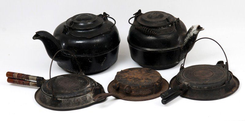 Antique Iron: Two cast iron kettles and three waffle irons