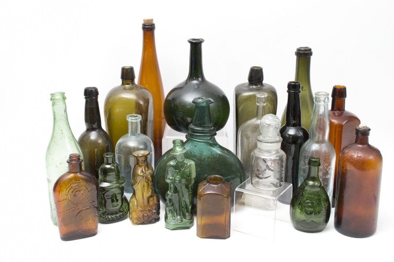 Antique & Style Bottles: Grouping of antique bottles including a Dutch onion form, hand blown beer bottle, a York Brewing Company bottle and medicinal bottles