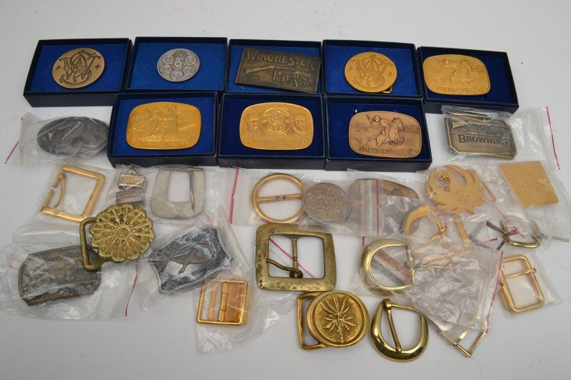 Smith & Wesson and other Gun Related Belt Buckles: Eight Smith & Wesson Belt Buckles, three Colt Firearms, one Winchester, one Remington, one Browning, one Peters and other unrelated buckles, most like new