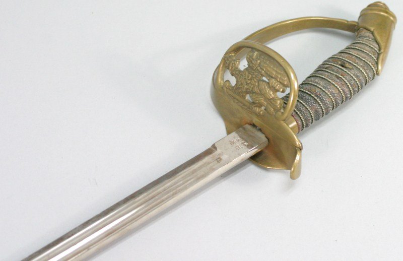 Prussian Infantry Officer Deluxe Model 1889 Sword: Prussian infantry officer deluxe model 1889 sword, gilt brass relief knuckle-guard twisted silver wire wrapped shark skin grip and scabbard, maker marks as photographed W.K & C, Kings head and Knights
