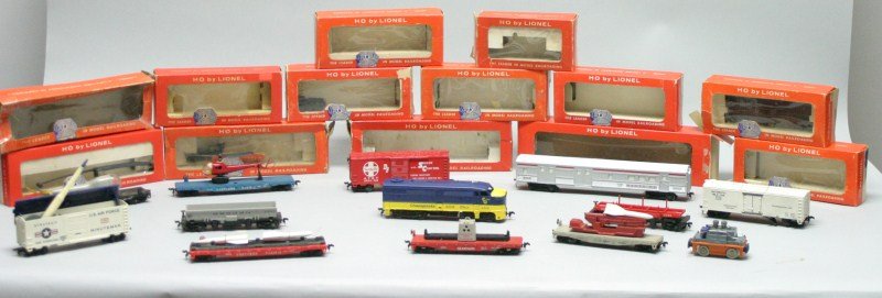 HO Lionel Train lot: 0366-Operating milk can car no cans; 0300-Operating log car no logs; 0823- Southern pacific twin missile; 0365-Minuteman missile launching car, 2 missiles; 0805-Illuminated radioactive waste disposal 