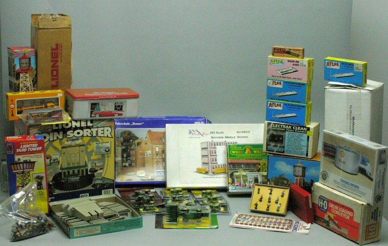Assorted Train Accessories Lot: Assortment includes Lionel talking coin sorter; minikins, John Deere; buildings; track cleaner; etc.