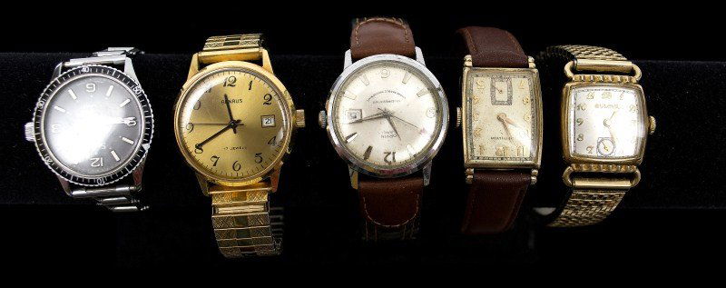 Five Vintage Wrist Watches: Five vintage wrist watches including a ladies' gold tone Bulova, a Hamilton ladies wrist watch, Orvin men's wrist watch, a Benrus men's wrist watch and a Sears men's wrist watch