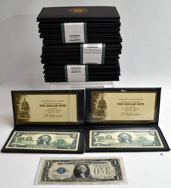 Fifteen Two Dollar Bills: Fifteen US two dollar bill in World Reserves Monetary Exchange binders, and one 1928 one dollar silver certificate