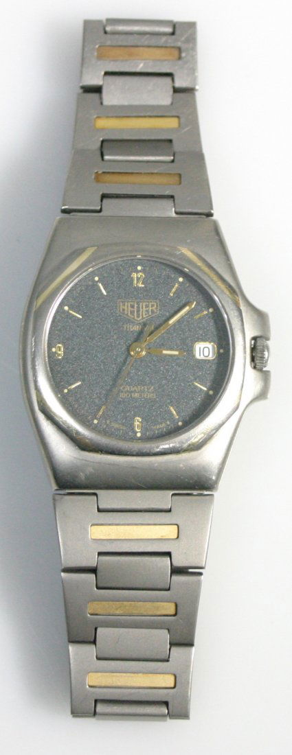 Tag Heuer Titanium: Mens Titanium mid-size watch; Clean two tone construction; appears to be in working order