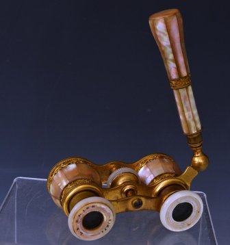La Reine of Paris, Opera Glasses: A pair of French mother of pearl opera glasses by La Reine of Paris, with folding handle, some loss on handle