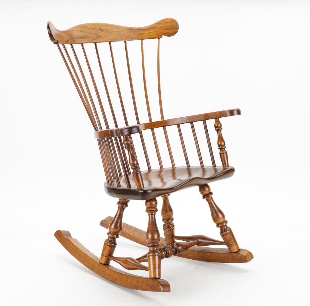 Miniature Comb Back Windsor Rocking Chair: A Mini comb back Windsor rocking chair made by a craftsman. Rocker measures approx. 22" high. Condition is as seen in photography.