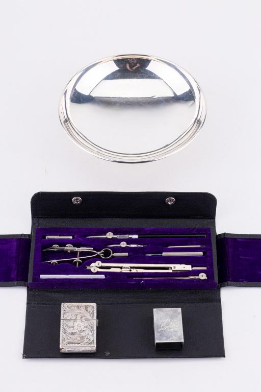 Sterling Silver Candy Dish, Match Box & More: Sterling silver Preisner candy dish (approx 2" H x 7" dia), S. Kirk & Sons sterling silver match box, 800 silver cigarette lighter with engraved design and Gramercy Import Co. Germany mechanical drawi