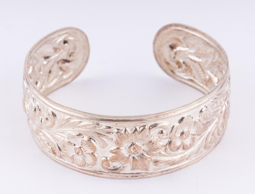 Sterling Silver S. Kirk & Son Cuff Bracelet: S. Kirk & Son signed sterling silver repousse cuff bracelet with internal wearable size of approx 2.25" x 2.5". Weighs approx 32.6g.