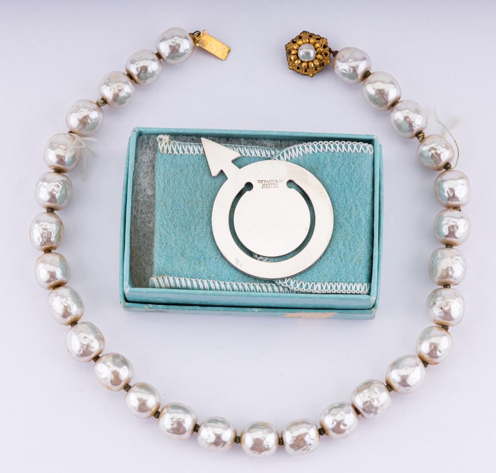 Tiffany Bookmark & Miriam Haskell Necklace: Tiffany clip bookmark in the shape of a male sign (approx 2" L) and Miriam Haskell freshwater pearl necklace (approx 30" L).