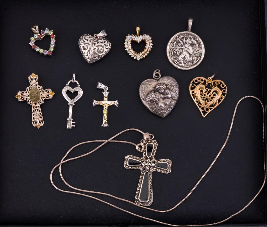 Sterling Silver Heart & Religious Pendants: Lot of 10 pieces of sterling silver jewelry includes one cross pendant with onyx and marcasite on chain that measures approx 22" L. There are nine more sterling pendants including three crosses, five 