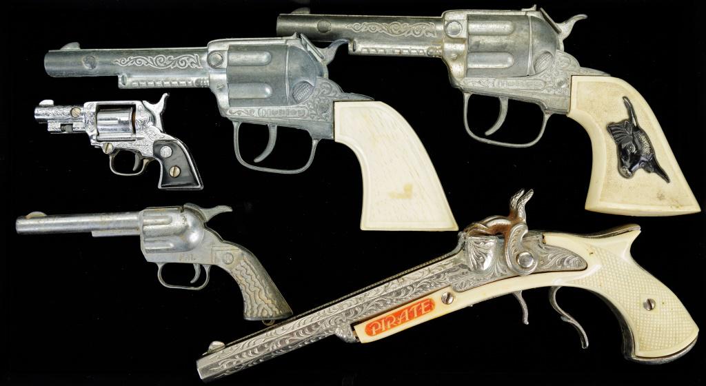 Toy Guns: Lot of five toy guns with largest (Pirate) measuring approx 9.5" L and smallest (Paint) measuring approx 3.5" L. Other names Hubley (2) and PAL. Oxidation present on the Pirate.
