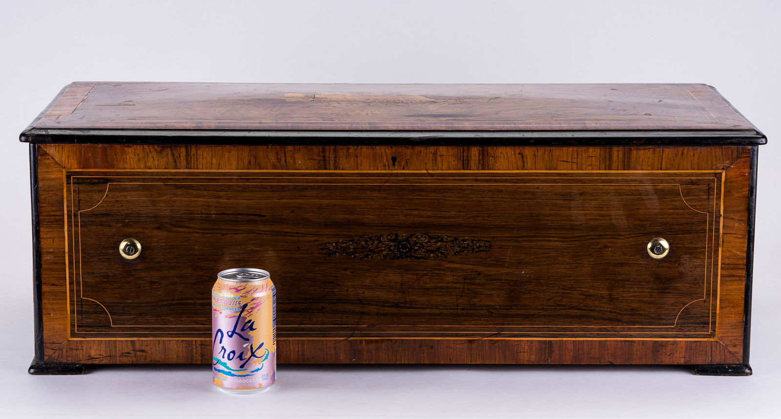 19th C German Music Box w/ Percussion: A large antique 19th century brass and nickel plated German music box with six bell and drum. The case is inlaid on top with multiple woods of a nature scene with swans and a pond. Music box has a lab