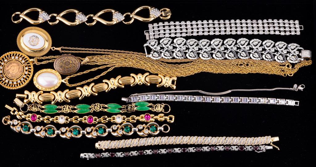 Gold Tone & Silver Tone Costume Jewelry: Silver ton and gold tone jewelry including garnet, Coro (four leaf bracelet), L.C. square stone tennis bracelet, Monet silver tone bracelet, Avon and "That Was"
