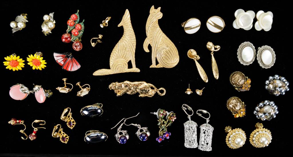 Monet, SAC & More Costume Jewelry: Lot of 24 items of costume jewelry includes both earrings and brooches with such names as Monet, SAC and Avon (2). There are also three unmarked gold tone brooches.