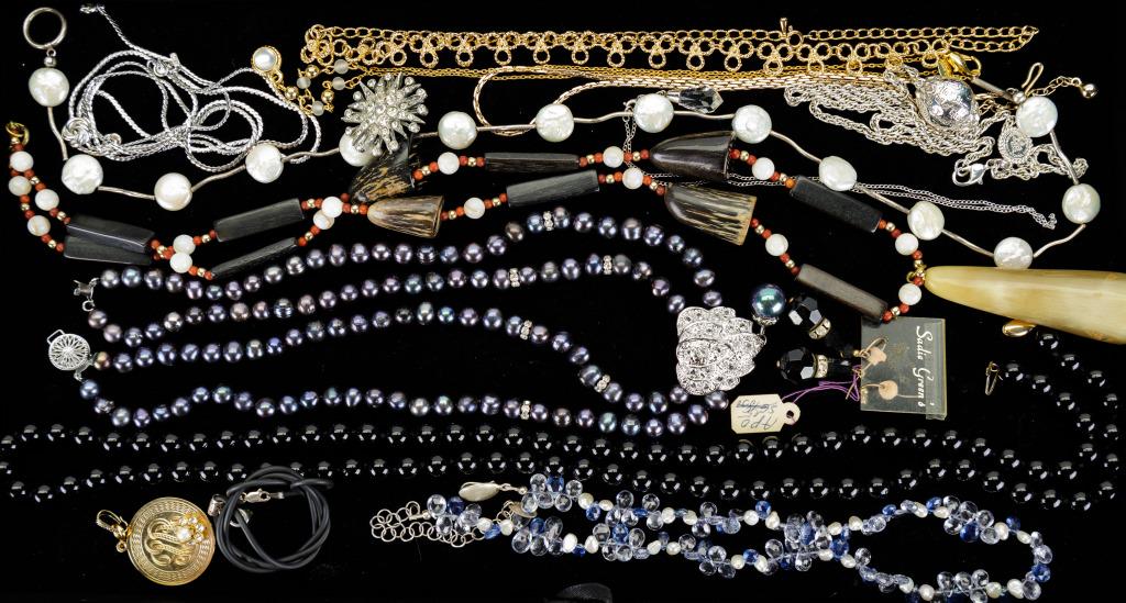 Onyx, Emerald, Tanzanite & More Jewelry: Necklaces, brooches, earrings, pendants and more. There is an onyx beaded necklace with 14K gold clip, emerald, tanzanite, horn and agate, gold tone (3), mother of pearl and all others test in the ran
