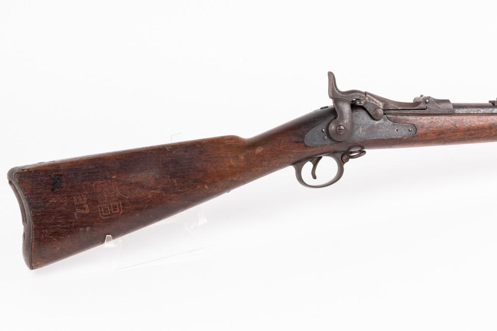 US Model 1884 Springfield Rifle: Springfield model 1884 military rifle. Rifle is dated 1891, unit marked, and rack numbered. Barrel is approx 35" long including the section with trapdoor mechanism on top. Serial number is 51816. Rifl