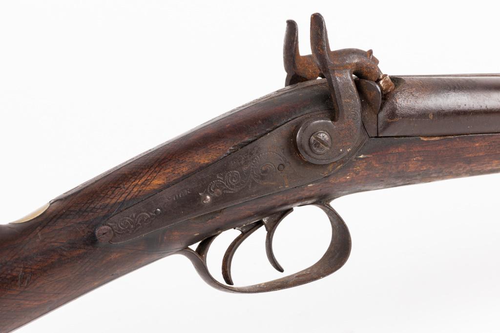 Double Barrel Percussion Shotgun Signed "Nock": Double barrel percussion shotgun with the name "Nock" signed in metal above the trigger guard on both sides. Barrels measure around 32" long. Light engravings can be found on the trigger guard, the me