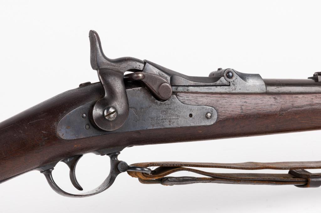 Model 1873 Trapdoor Springfield Rifle: Model 1873 Trapdoor Springfield. Lock has an eagle and "U.S Springfield" stamped. Barrel is approx. 33", and gun has a leather strap mounted on the gun along with the original ramrod. Appears to be in