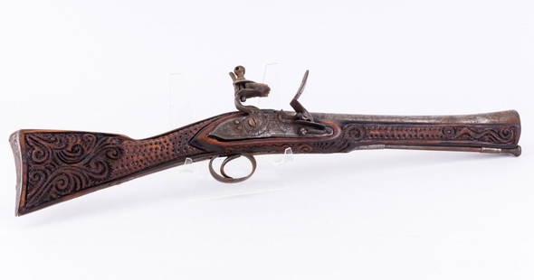 Flintlock Blunderbuss: Flintlock blunderbuss, thought to be made from old and new parts or a replica. Measures approx 22" L. The flintlock side plate appears to be antique, ram rod made of steel smooth round stock.