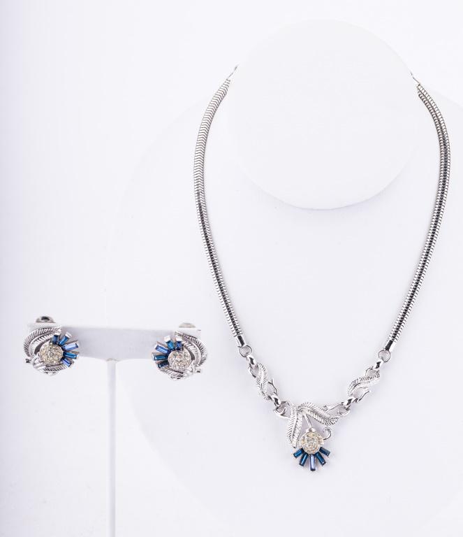 Rare Antique Trifari Jewelry: Circa 1940's signed Trifari necklace with blue to clear rhinestone necklace with matching clip earrings in retro style.