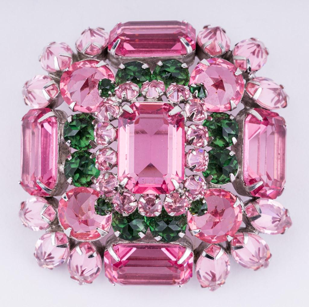 Rare Pink Schreiner New York Brooch: Outstanding bright pink stone brooch with green accents signed Schreiner New York.