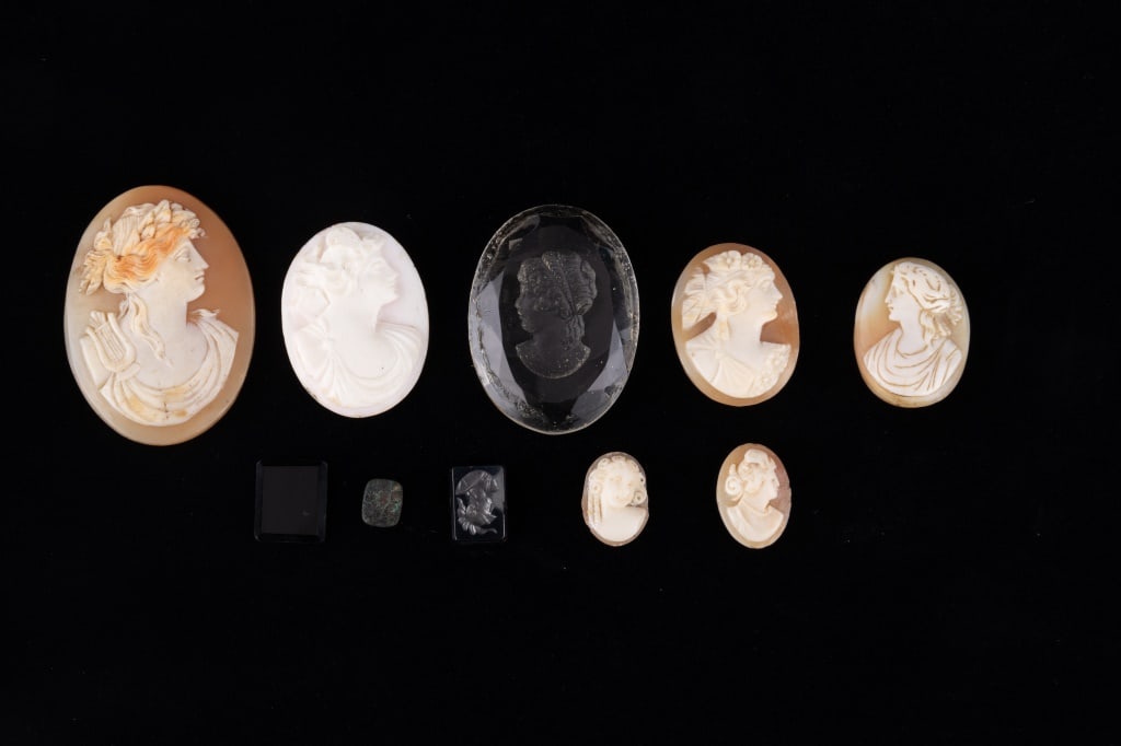 Shell Cameo and Cameo Style: Five carved shell cameos of women, largest measuring approx. 1.75" x 1". Also included in the lot are three cameo style items, a crystal/glass cameo, a cameo on white (heavy), a small cameo style char