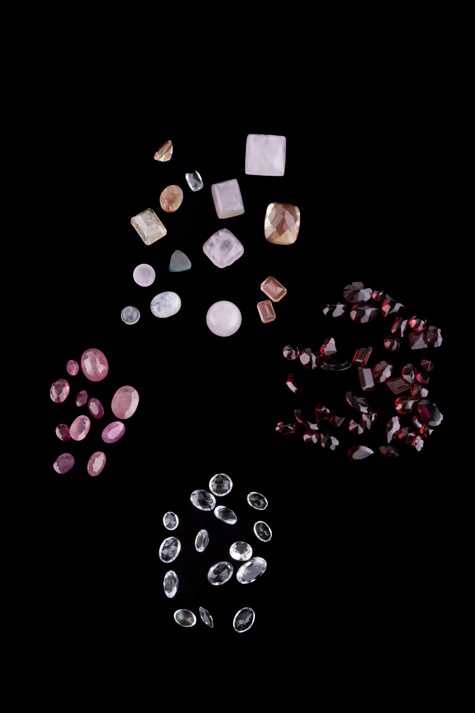 Precious and Semi-Precious Gems & Other Stones: A collection of gems and semi-precious stones consisting of 43 gems with hardness test of garnet (6.9 grams cumulative), 15 stones with hardness test of quartz, 11 stones with hardness test of ruby (2