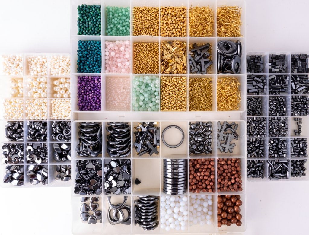 Large Lot of Beads & Jewelry Findings: Four boxes of jewelry and jewelry findings including hematite, glass, freshwater pearl and more.
