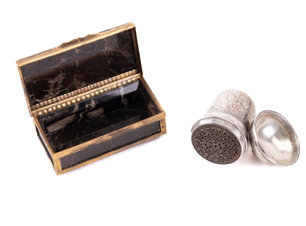 Antique Agate Pill Box & Sterling Needle Sharpener: Antique agate pill box measures approx 2.5" L x 1" W x 0.5" H and an unmarked sterling silver needle sharpener with a piece of rosin present. The stone on the pill box has a crack but stable in place.