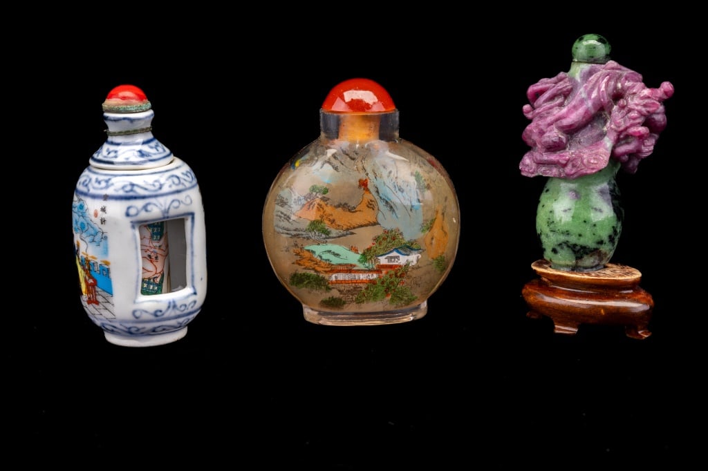 Chinese Snuff Bottles Jade, Porcelain, Glass: Three Chinese snuff bottles including jade (approx 3.25" H, tests for nephrite jade), porcelain (with erotic scene) and one glass painted.