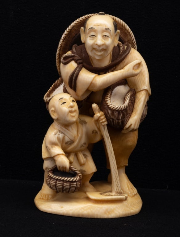 Antique Carved Father & Son Figurine: Antique Japanese figurine of father and son carved into bone. Measures approx 4.5" tall. Signed with Japanese characters on the bottom.