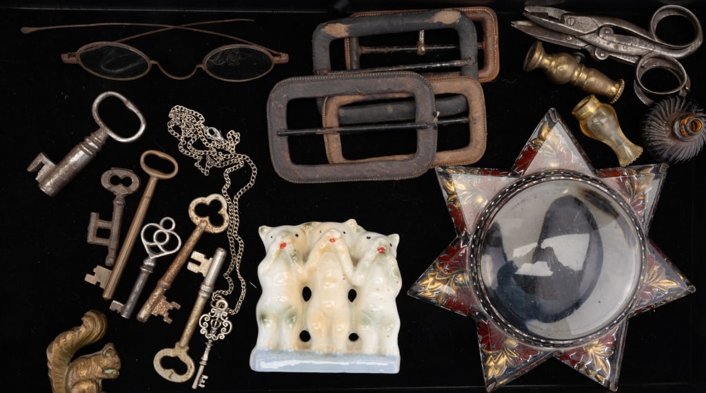Antique Keys, Spectacles, Paperweight & More: Antique spectacles, several skeleton keys, small Japanese dog figurine, 4 leather belt buckles, perfume bottle, bronze squirrel figurine, scissors, large glass star paperweight (approx 6" dia) and mor