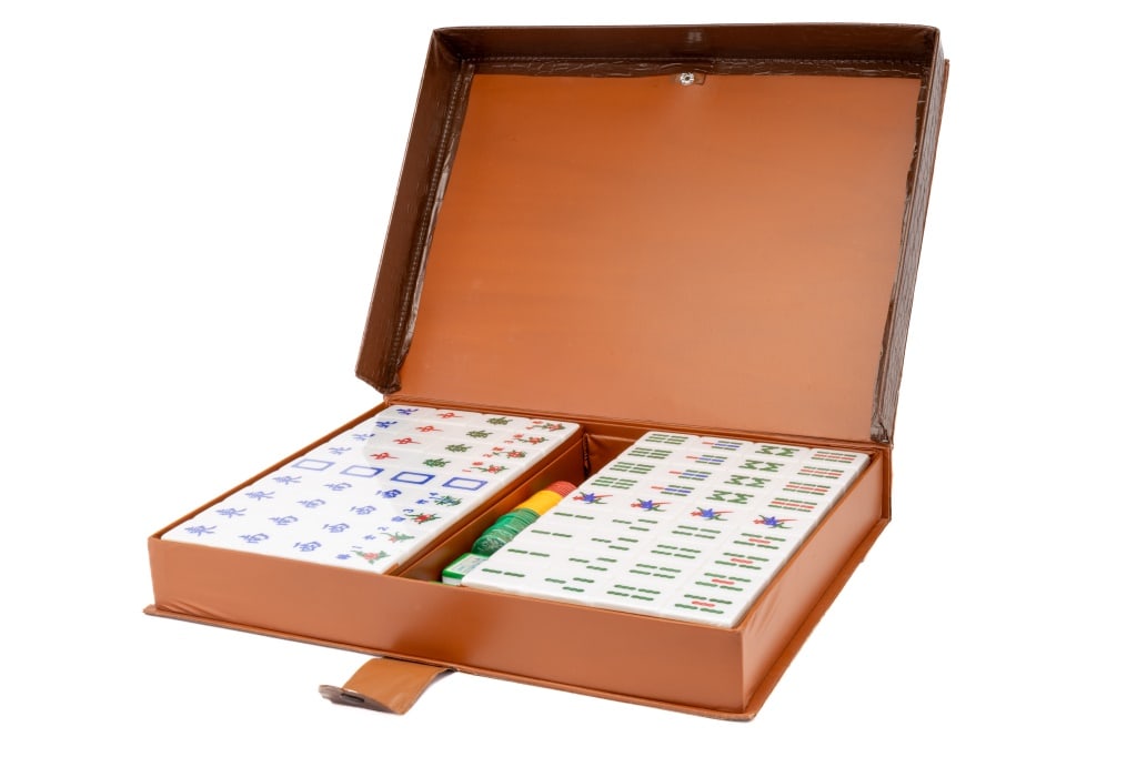 Mahjong Game in Original Case: Mahjong game that appears to have minimal use and still in plastic wrap. Case measures approx 2" x 15" W x 11".