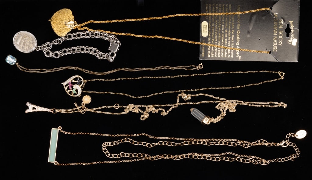 Sterling Silver Charm Bracelet, Gold Fill & More: Sterling silver charm bracelet with "a date to remember" with birth date. Approx 21" gold tone necklace with Eiffel tower pendant, approx. 18" gold tone necklace, a long 24K gold plated leaf necklace 