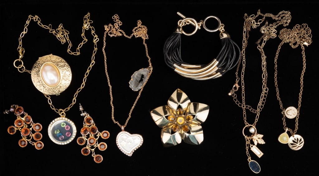 Sterling Silver Brooch & Gold Tone Jewelry: Jewelry consisting of a large sterling silver flower brooch with gold wash and amber colored glass accents, trinket box, two gold tone necklaces, two gold tone necklaces with window pendants, black an
