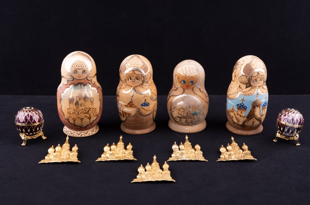 Matryoshka Russian Nesting Dolls, Brooches & More: Russian Matryoshka dolls or nesting dolls, signed on the bottom. Largest measures approx 5.5" H. Also included are five JJ designer St. Basil's Cathedral (Moscow, Red Square) and two small decorative