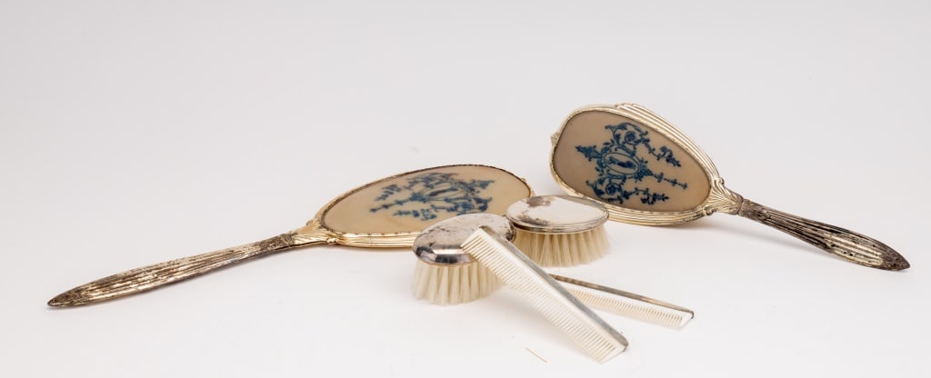 Sterling Antique Brushes, Combs, Mirror: All items are marked sterling including mirror (approx 13.5") (handle is silver plated), handled brush (handle silver plated), small Reed & Barton brush and comb, small Lullaby 1904 brush and comb. Th